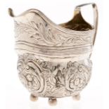 A George III silver cream jug, later chased, 10.5cm h, marks rubbed, London 1807, 4ozs 15dwts No