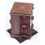 Miniature Furniture. An Edwardian mahogany and inlaid rotating bookcase and the original set of 40