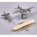 Three silvered resin or other models aircraft, to include Mosquito, 36cm l Good condition