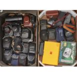 A collection of 35mm SLR and compact cameras, including Praktica and Olympus, 1960's and later,