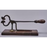A pair of early Victorian steel sugar cutters, with turned fruitwood handle and base, 34.5cm l