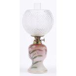 An enamelled shaded pink satin glass oil lamp, c1890, with German brass burner and a cut glass