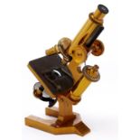 A brass compound microscope, R & J Beck Ltd London, No 24869, c1900, the limb on trunnions at the