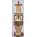 A Chinese archaic style brass table lamp, 20th c, with dragon handles and band of taotie, 60cm h