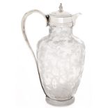 A silver mounted etched glass claret jug, of shouldered form decorated with blossoming boughs,