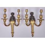 A pair of French bronze and ormolu demi figure wall lights, 20th c, in Louis XVI style, 31.5cm h