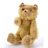 A Farnell miniature soldier or  mascot teddy bear, c1930, in yellow gold mohair Worn condition