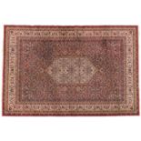 A Persian style medallion rug, c1900, with red ground, 200 x 297cm Worn in places