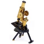 A brass compound microscope, J Swift & Son London, c1900, the limb on trunnions stamped PATENT, with