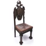 An unusual carved and stained oak and tooled leather chair, 19th c, Spanish or Spanish