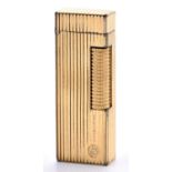 An Alfred Dunhill gold plated Rollagas cigarette lighter, cased Lighter showing signs of use, slight