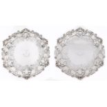 A pair of Scottish George III silver waiters, flat chased with grapevines within rococo border, on