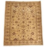 A reproduction Ziegler style carpet, the sand coloured field worked overall with flowerheads,