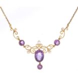 An amethyst, pearl and gold necklace, c1910, centre section 37mm, 46cm l, 10.6g, maroon morocco case