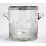An EPNS mounted glass ice bucket, 20th c, wheel engraved with a sportsman, hound and game in a