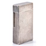 An S T Dupont silver plated cigarette lighter, No P-7GB07 Small knocks and wear to plating on