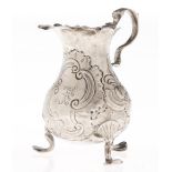 A George II silver cream jug,  later chased, 90mm h, marks rubbed, London 1751, 2ozs 10dwts Even