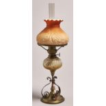 A brass and copper oil lamp, late 19th c, with spirally reeded glass fount and German brass