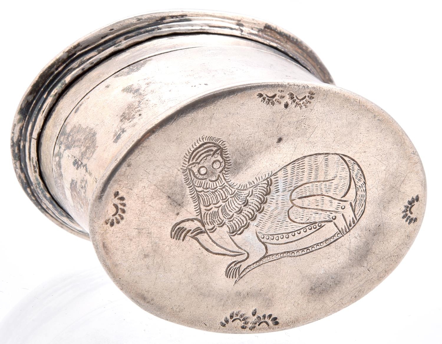 A Burmese oval silver lime box and repousse cover, early 20th c, the cover worked with a recumbent - Image 2 of 2