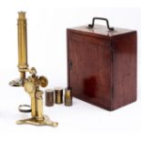 A brass compound microscope, Negretti & Zambra London, c1870, the limb on pillar with compass joint,