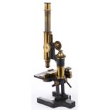 A brass compound microscope, Ross London, No 6083, late 19th c, the limb on trunnions above two