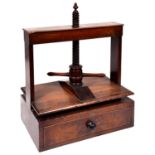 An English mahogany book press, early 19th century, with frame, helix and two handles, the