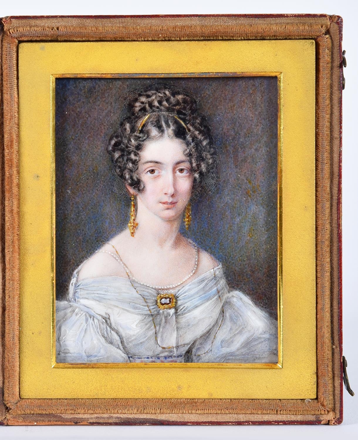 J or T Wheeler (fl. 1817-45) - Portrait miniature of a Lady, her dark hair in ringlets, with gold