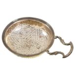 A George III silver orange or lemon strainer, with reeded rim, lug and handle, 13.3cm l, by Edward