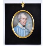 English School, 19th c - Portrait Miniature of an Officer, in blue tunic with silver lace, sky