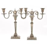 A pair of Old Sheffield plate candelabra, late 18th century, of two lights with looped and reeded