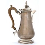 An Elizabeth II silver lidded jug, of baluster shape, 24cm h, by C J Vander Limited, London 1967,