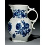 A Worcester cabbage leaf-moulded mask jug, c1770, transfer printed in underglaze blue with the