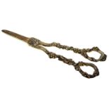 A pair of Victorian silver gilt grape shears, Vine pattern, by Henry Holland and Son, London 1869,