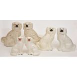 Three pairs of Staffordshire earthenware models of spaniels, late 19th c, 39cm h and smaller Typical