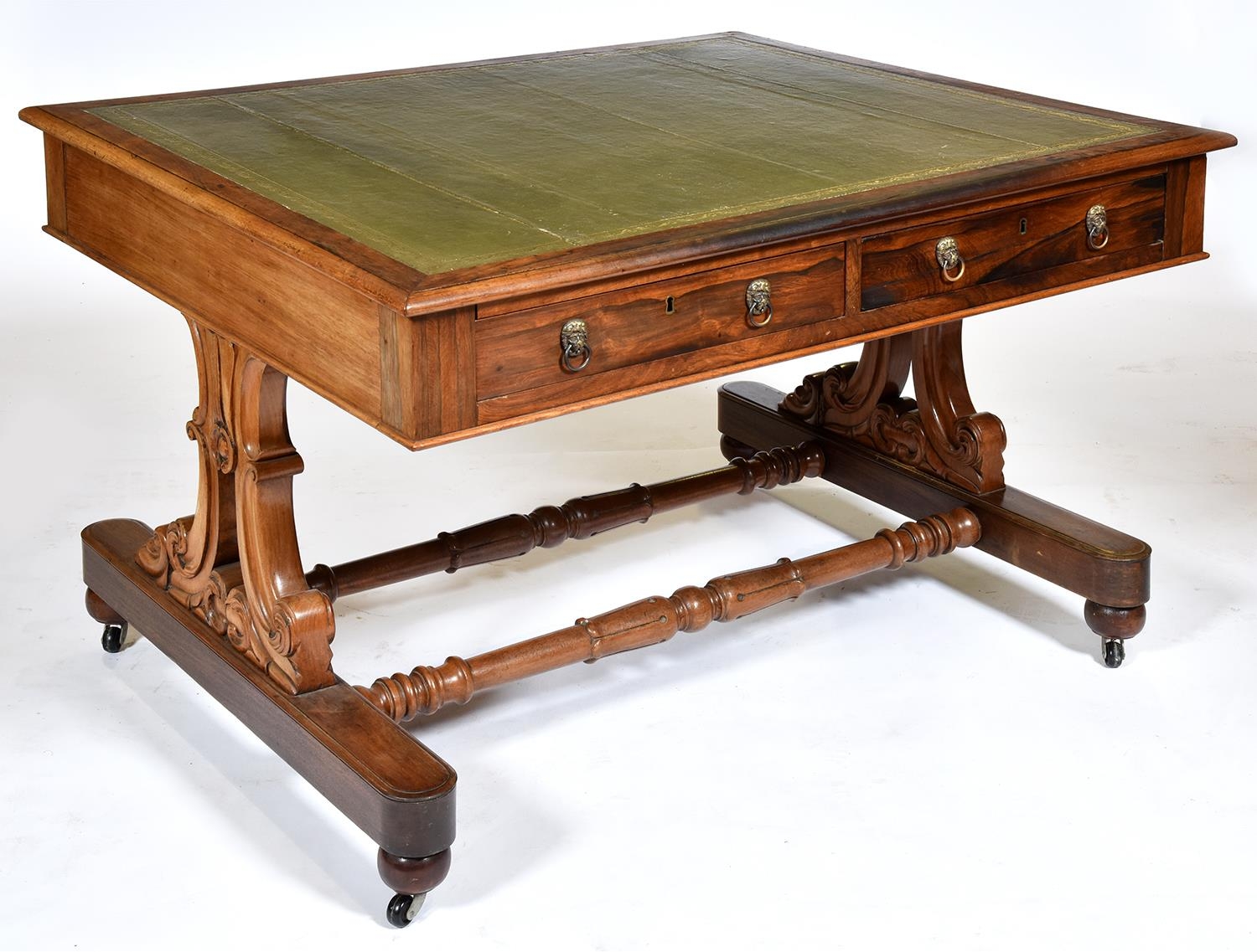 A William IV rosewood library table, c1835, the rectangular leather inlet top fitted with two