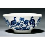 A Worcester bowl, c1780, transfer printed in underglaze blue with the Birds in Branches pattern,