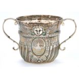 A Victorian silver William III replica porringer, of spirally lobed and fluted shape with cable