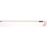 A marine ivory and whalebone walking cane, 19th c, with baleen bands, brass tip, 88cm the curved