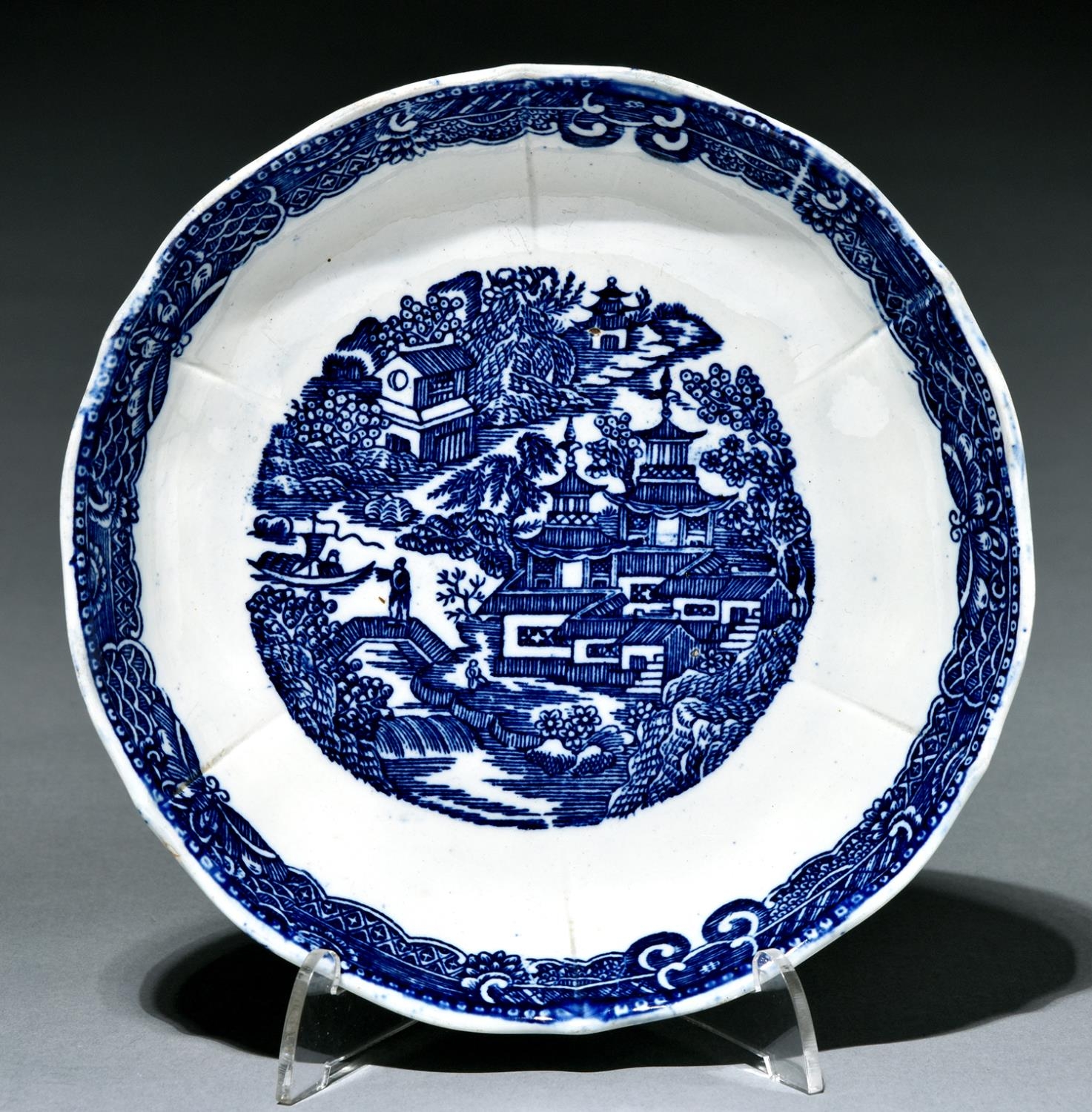 A blue printed pearlware saucer dish, c1790, with a full Nankin type pattern, 18cm diam Good