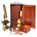 An English bar limb microscope, late 19th c, with eyepieces and objectives, mechanical stage and