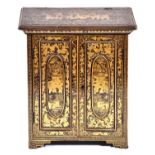 A Chinese black and gold export lacquer table cabinet, early 19th c, the panelled doors enclosing