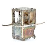An Edwardian silver sedan chair novelty inkwell, cast with scenes and rocaille, containing silver