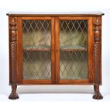 A George IV mahogany chiffonier, c1830, enclosed by a pair of glazed brass grille doors flanked by