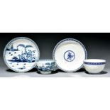 A Worcester tea bowl and saucer and a reeded example, c1770, painted in underglaze blue with the