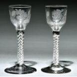 Two George III wine glasses, c1770, the Jacobite engraved ogee bowl with rose and bud, thistle and