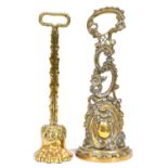 Two Victorian brass doorstops of rococo or lion's paw design, mid 19th century, iron or lead