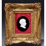 A biscuit porcelain bas relief portrait of Lord Byron, 19th century, on oval black glass mount,