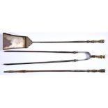 A set of three Victorian burnished steel fire irons, mid 19th century, with brass baluster and