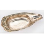 A George III silver pap boat, the beaded rim with Venus shell and grapevines, 15.5cm l, maker -W,