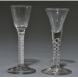 An English wine glass, c1750, with drawn trumpet bowl on 'mercury' twist stem, 16.7cm h; and